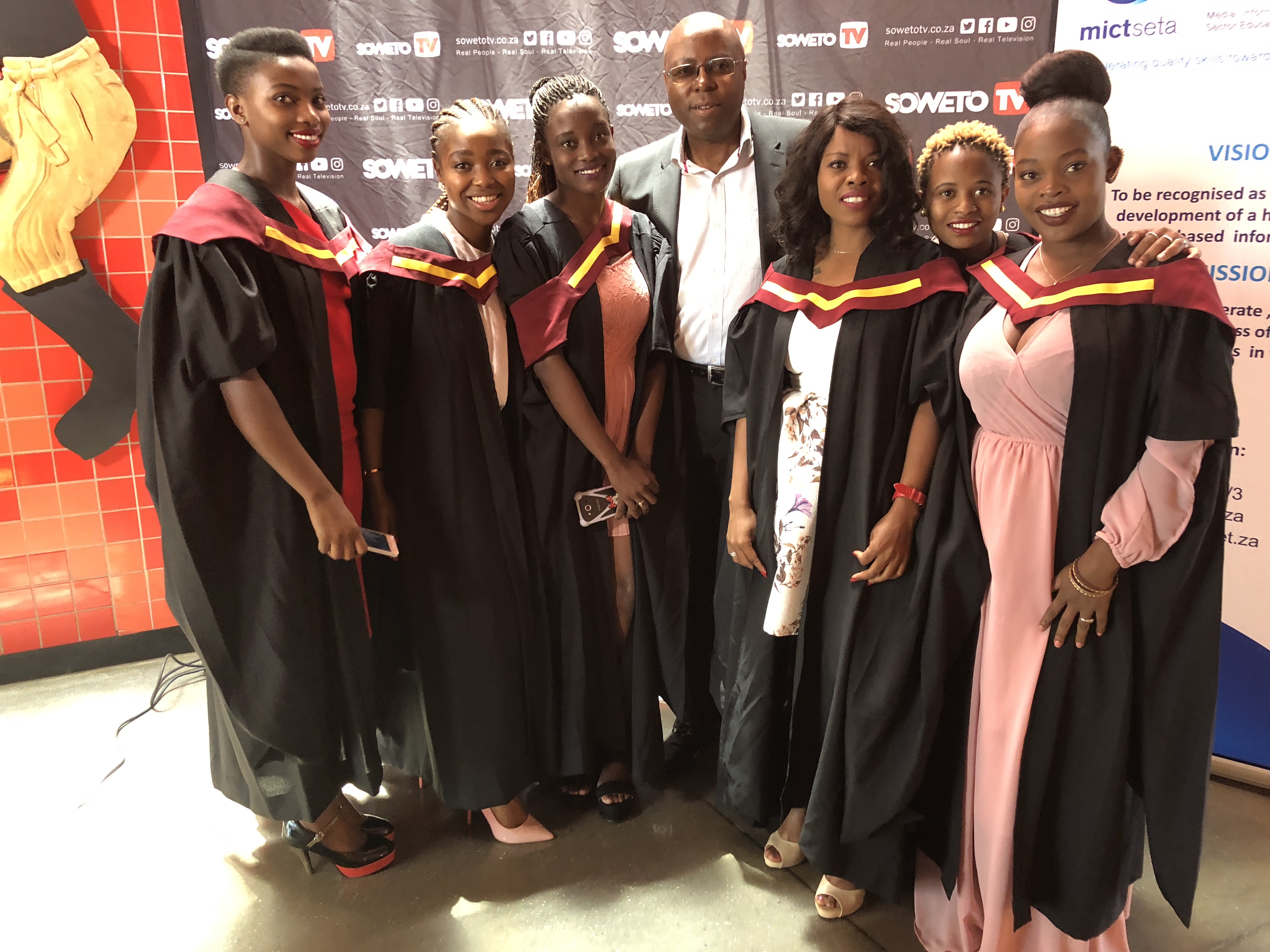 Group of graduates posing with a Limco representative during a learner recognition moment.